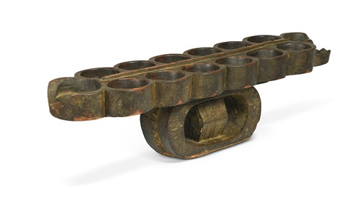Lot 521 - A Ghanaian carved wood Ashanti Awale gameboard