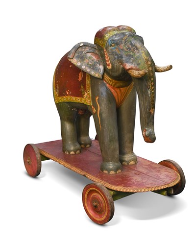Lot 551 - A North Indian carved wood lacquered model of an elephant, circa 1900