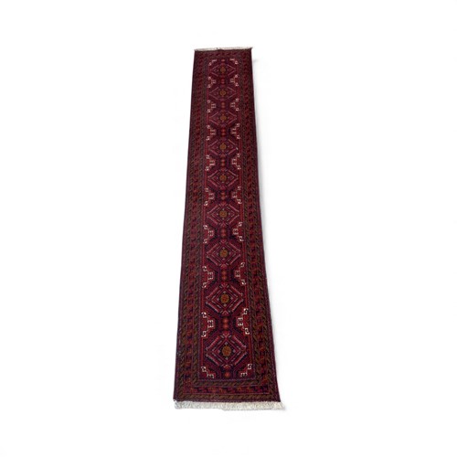 Lot 821 - A hand-knotted Beluchi runner, late 20th...