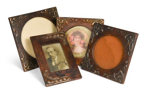 Lot 102 - Four Art Nouveau metal-mounted and leather photograph frames