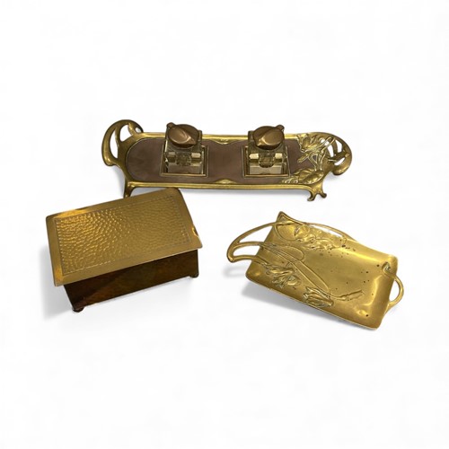Lot 79 - A WMF hammered brass cigarette box, together...