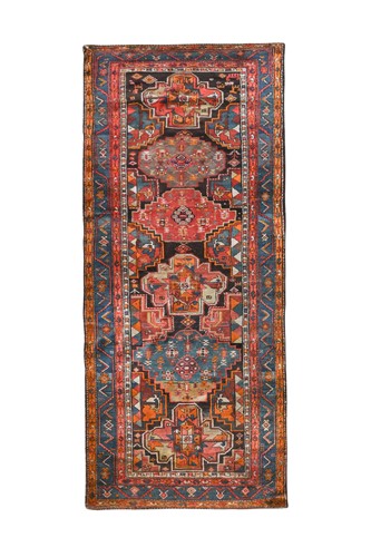 Lot 497 - A Kurdish tribal runner rug, circa 1930