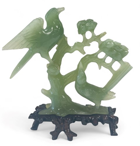 Lot 33 - A Chinese celadon jade bird group, 20th century