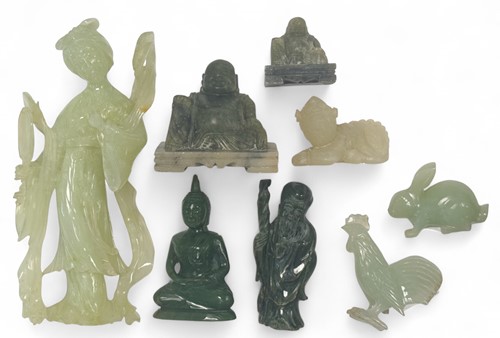 Lot 34 - A Chinese celadon jade carving of a crouched rabbit, 20th century