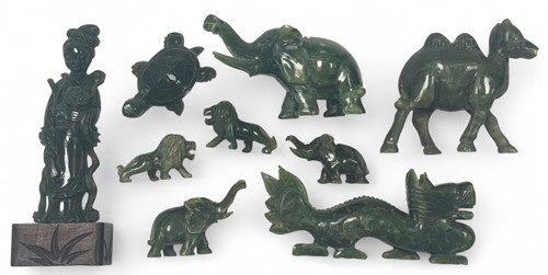 Lot 30 - A Chinese spinach green jade carving of a dragon, 20th century