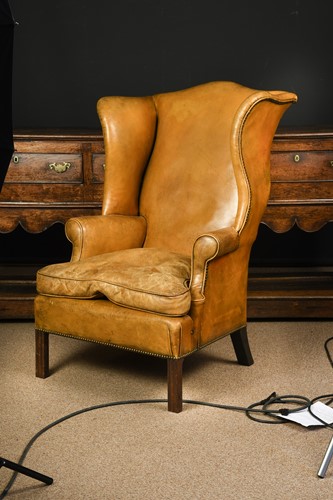 Lot 558 - A mahogany wingback armchair, 19th century