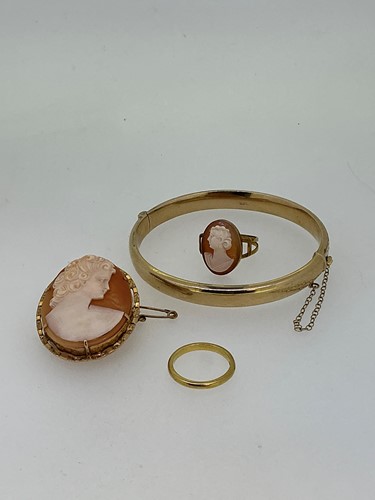 Lot 276 - A bangle with a faint hallmark for 9ct gold...