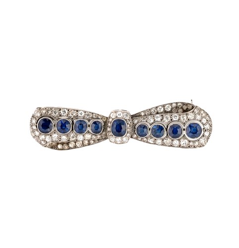 Lot 192 - An early 20th century sapphire and diamond bow brooch
