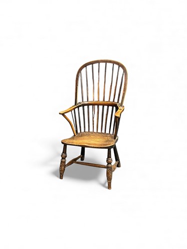 Lot 389 - A low seated ash and elm spindle back armchair,...