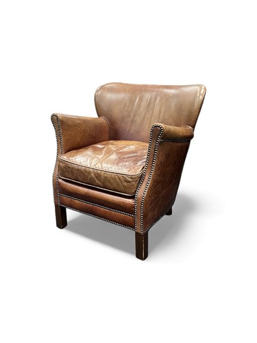 Lot 714 - A modern brown leather club armchair, on...