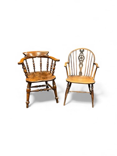 Lot 708 - A beech and elm captain's type elbow chair,...