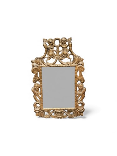 Lot 684 - A 17th century style carved oak mirror, the...