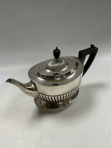 Lot 332 - A Regency style silver oval teapot, half...