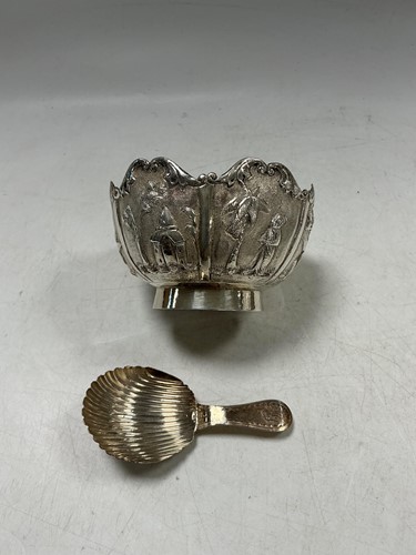 Lot 308 - A far Eastern silver sugar bowl embossed with...
