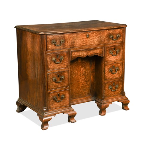 Lot 384 - A George II flame mahogany kneehole desk