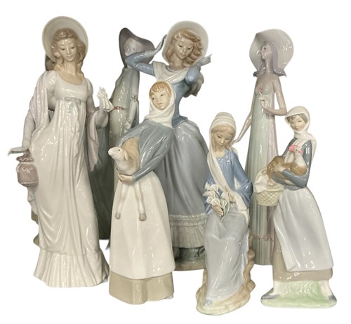 Lot 36 - A collection of eight Lladro figures of ladies,...