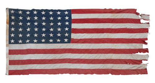 Lot 676 - A large WWII battle-worn single-panel 48-star US Naval flag, dated 1943