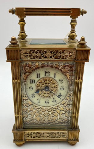 Lot 105 - A brass cased carriage timepiece with swing...