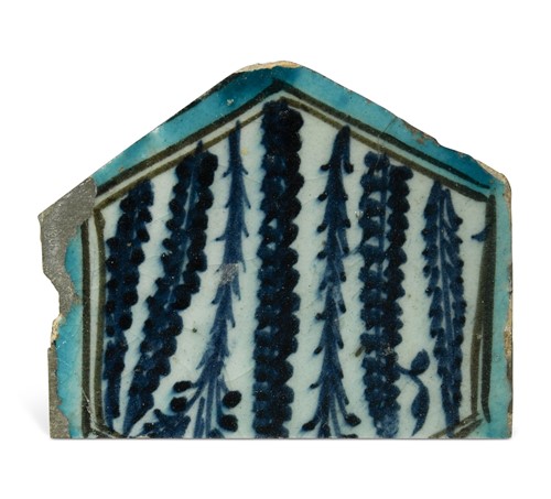 Lot 523 - An Islamic Egyptian or Syrian Mamluk tile fragment, 15th century
