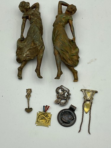 Lot 76 - A pair of spelter figural mounts; a Lalique...