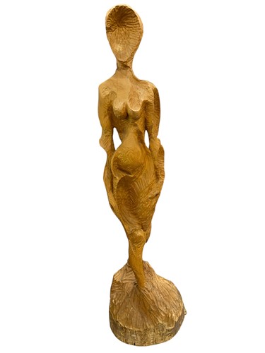 Lot 186 - A large carved wood figure of a stylised woman...