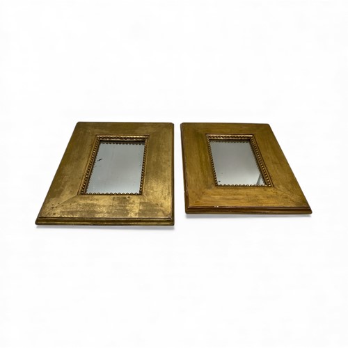 Lot 785 - A pair of small wall mirrors with beaded...