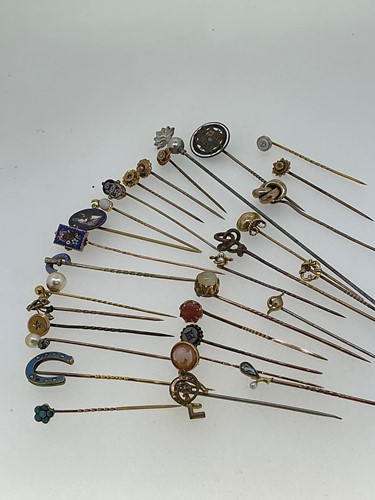 Lot 250 - A collection of decorative stick pins,...