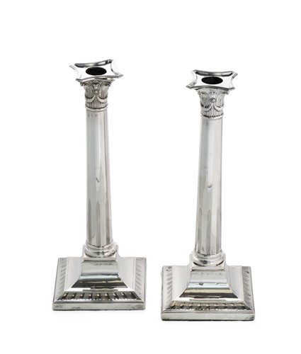 Lot 334 - A pair of George III silver candlesticks