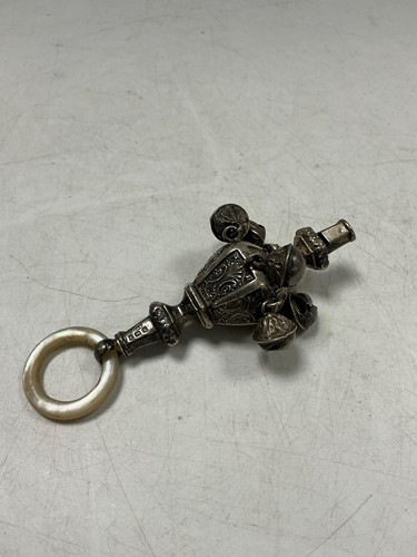 Lot 304 - An Edwardian silver rattle, Birmingham 1905...