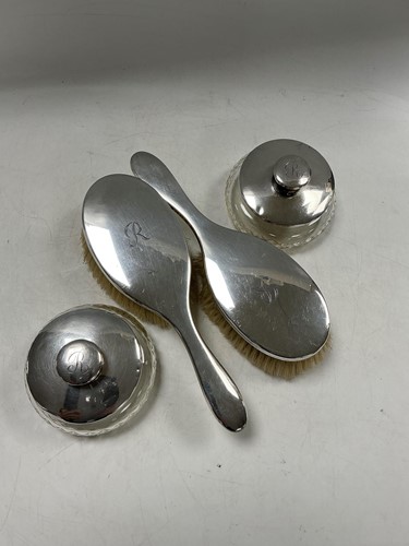 Lot 312 - A hallmarked silver dressing table set...