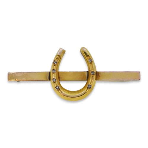 Lot 37 - A horseshoe brooch set with rose cut diamonds