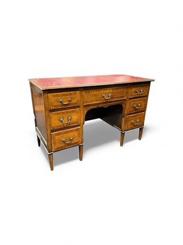 Lot 561 - An Edwardian kneehole desk or dressing table...
