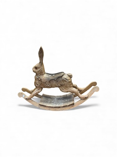 Lot 788 - A child's carved wooden rocking toy hare, with...