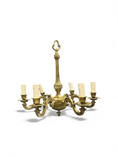 Lot 758 - A brass chandelier with six overscrolled...