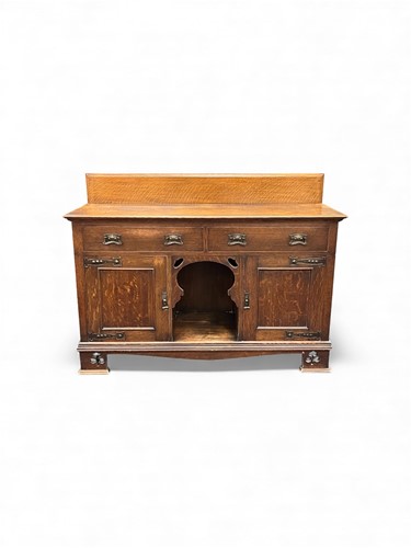 Lot 673 - An Arts & Crafts oak sideboard, comprising of...