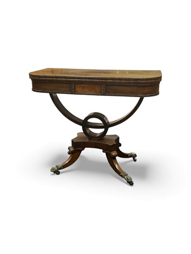 Lot 620 - A Regency mahogany card table, on a shaped...