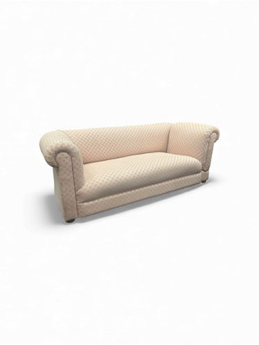 Lot 636 - An Edwardian drop end settee, raised on squat...