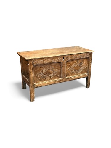 Lot 686 - An 19th century carved oak coffer, twin...