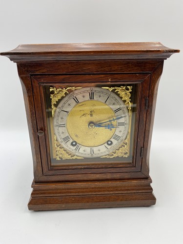 Lot 178 - An early 20th century mantel clock with brass...