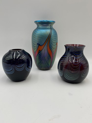 Lot 17 - Three Okra swirled art glass vases, each...
