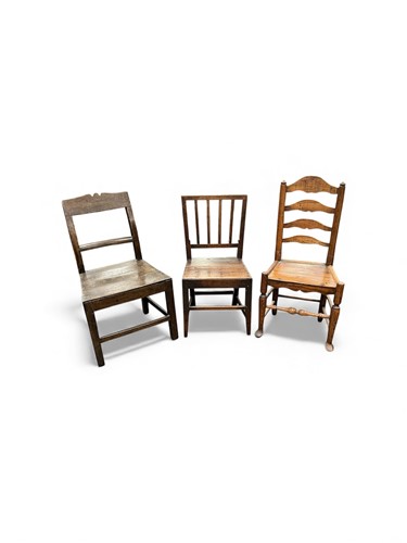 Lot 700 - A George III provincial oak stick back chair,...