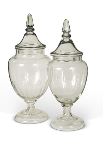 Lot 668 - Two large glass apothecary pharmacy jars and covers