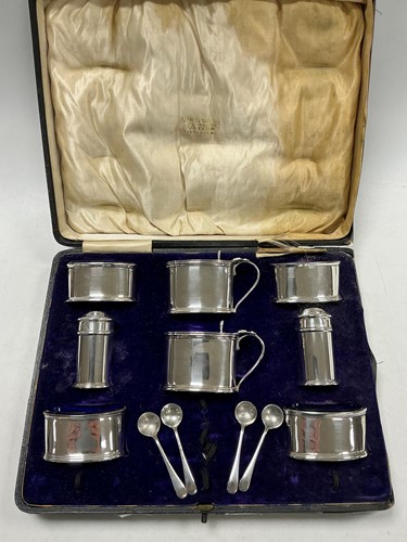 Lot 335 - An Edwardian cased silver cruet set by Deakin...
