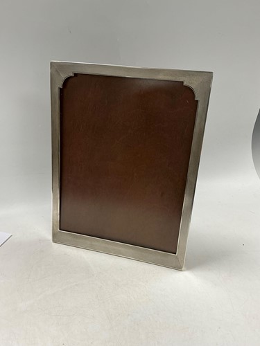 Lot 337 - An engine turned silver photograph frame,...
