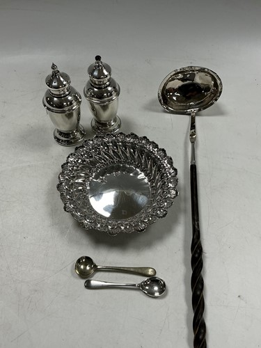 Lot 329 - A group of silver items to include a salt and...