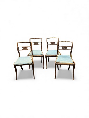Lot 446 - A set of four Regency mahogany sabre leg...