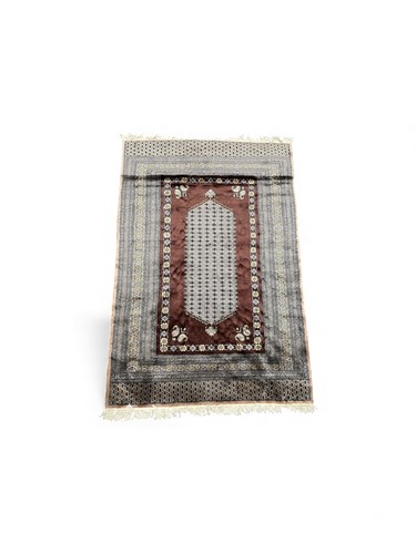 Lot 814 - A Persian wool rug, modern, the brown ground...