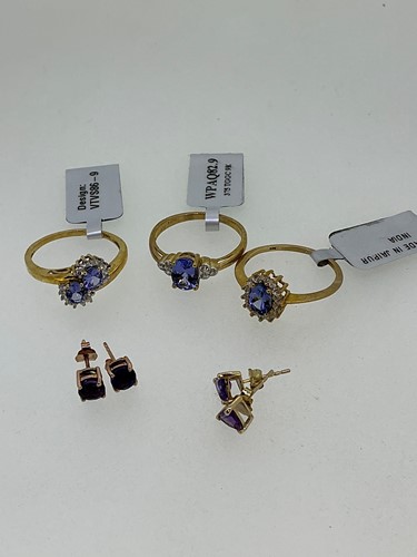 Lot 255 - Three hallmarked 9ct gold tanzanite and zircon...