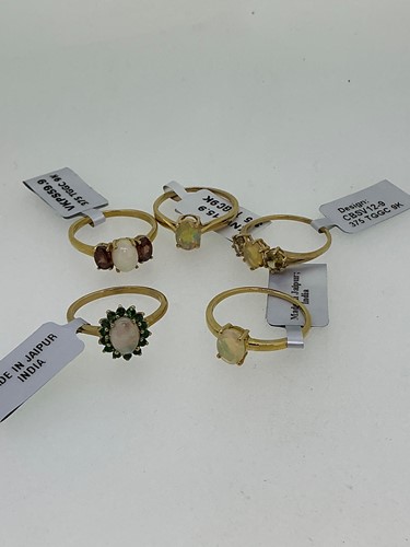 Lot 256 - A collection of five hallmarked 9ct gold opal...