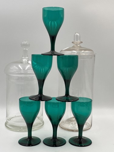 Lot 61 - Six dark green wine glasses, 19th century;...